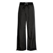 Avslappede svarte bukser med elastisk linning