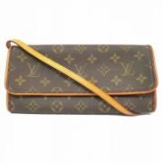 Pre-owned Brunt lerret Louis Vuitton Clutch