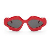 Røde solbriller med oval linseform