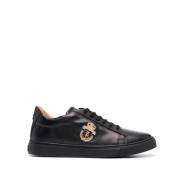 Svart skinn lav-topp sneakers crest