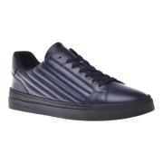 Trainers in dark blue quilted leather and leather