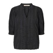 Elegant Svart Bluse med Moderne Detaljer