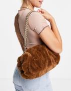 ASOS DESIGN oversized ruched clutch bag in brown faux fur with detacha...